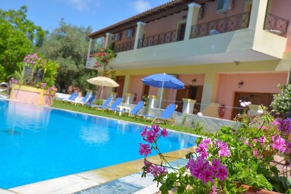 Swimming pool and apartments at Alex Katerina in Peroulades, Corfu