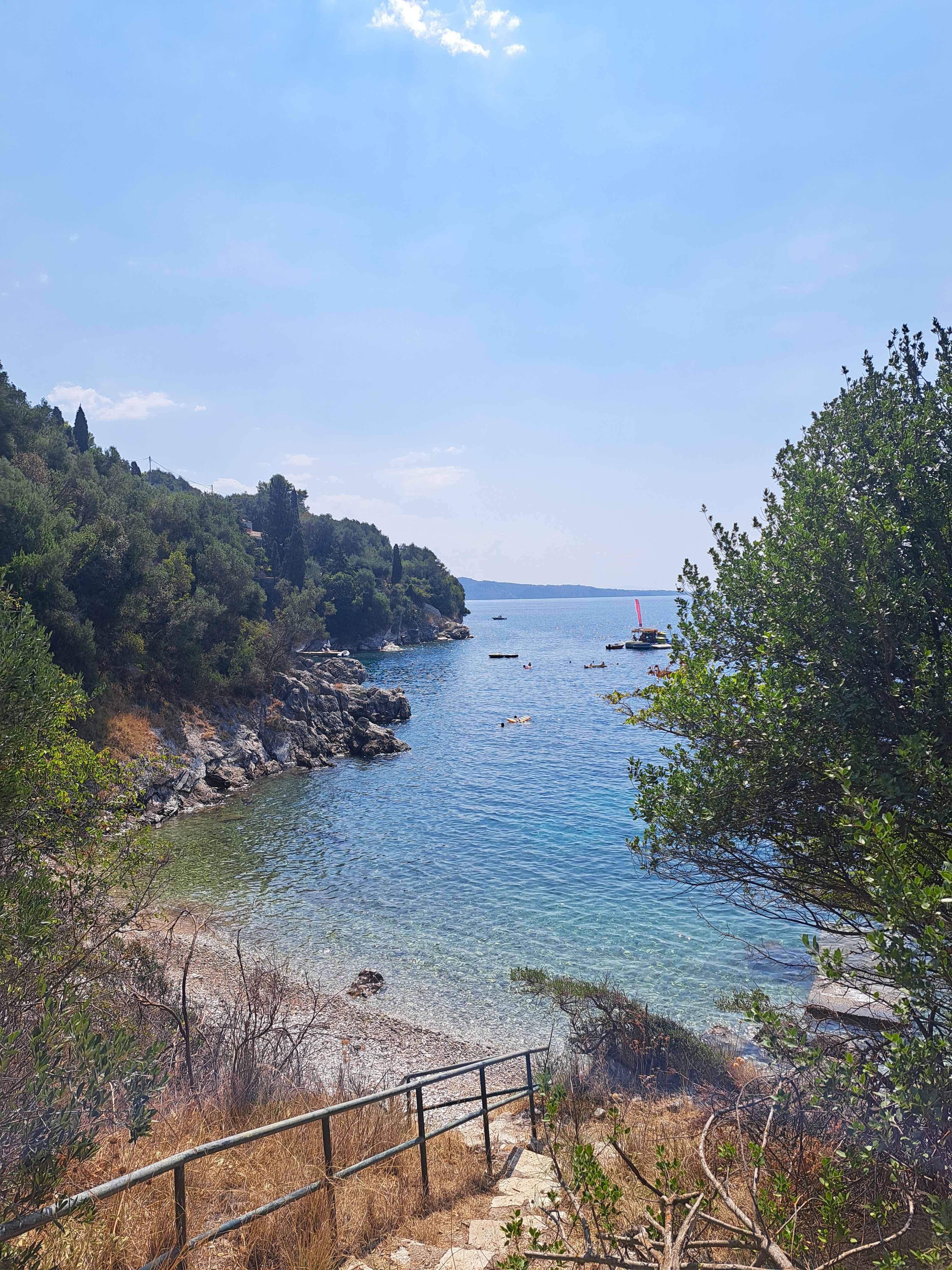 Seasonal sunbeds and parasols are available along the organised beach.