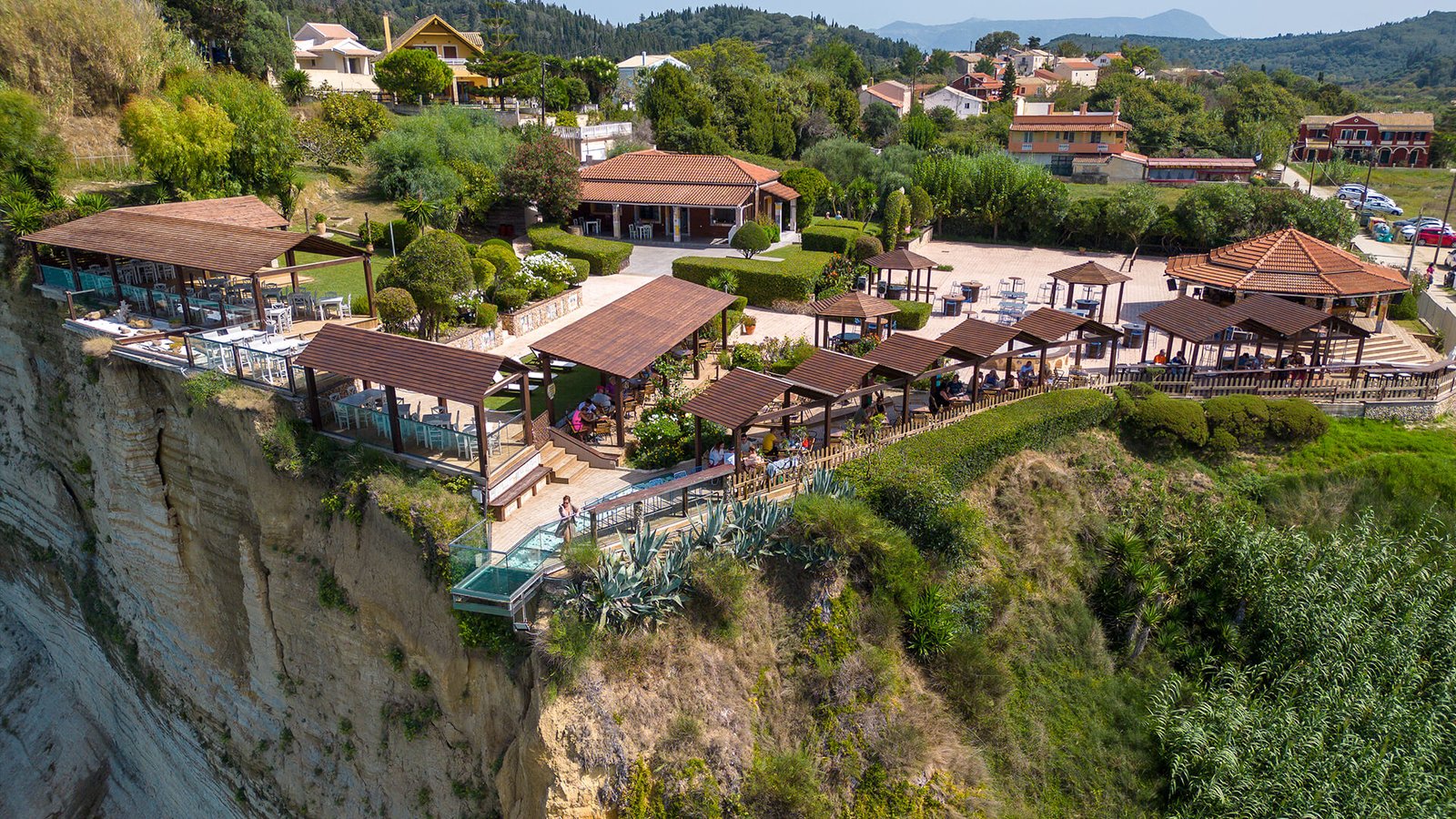 Dysis Restaurant on the cliffs above Loggas Beach in Peroulades, Corfu