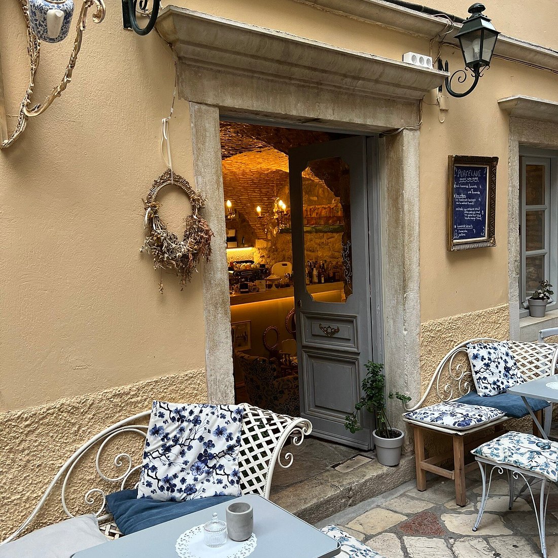 Porcelani Café and Wine Bar entrance and outdoor seating in Corfu Old Town
