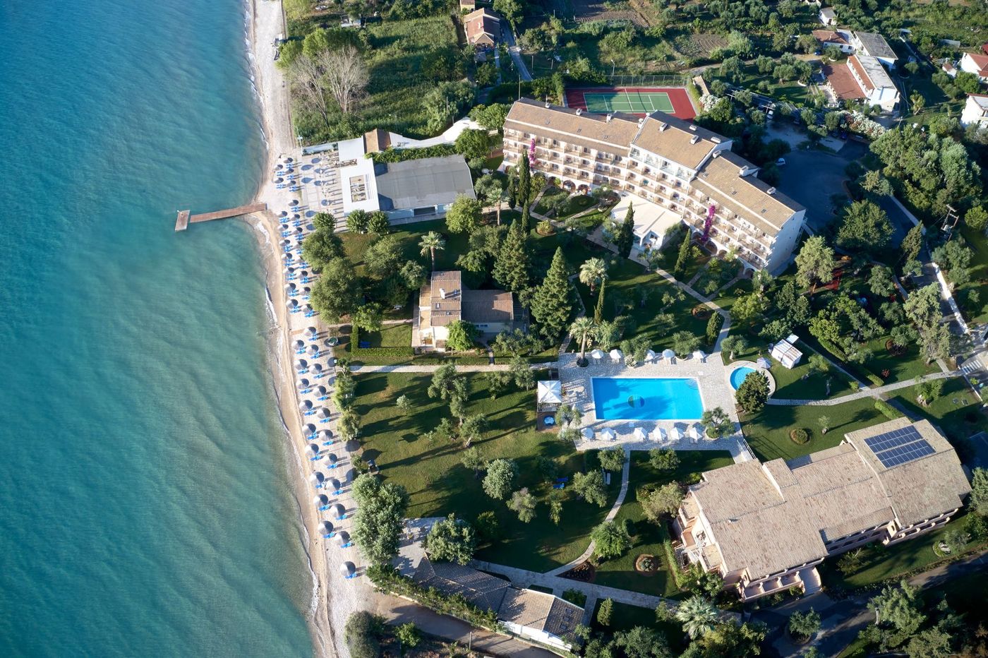 Delfinia Hotel is a beachfront resort hotel in Moraitika, South East Corfu, set in extensive gardens with direct access to the Ionian Sea.