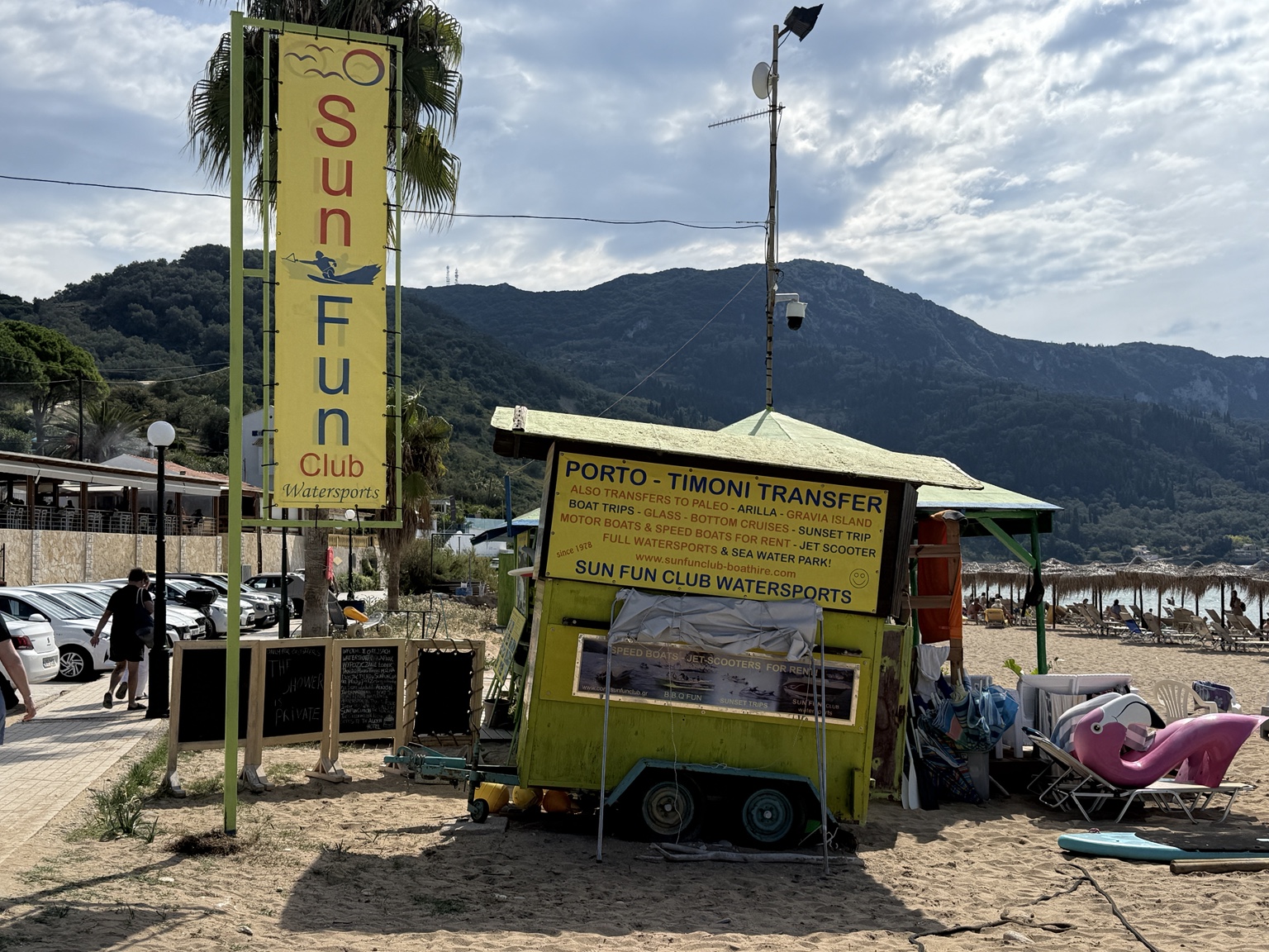 A specialist beach wheelchair with Municipality of Corfu markings was present beside the beach base during our visit. Ownership/operation by Sun Fun Club has not been confirmed; check locally before relying on availability.