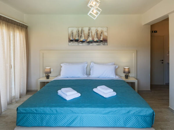 Bright double bedroom at Aria Suites in Kassiopi, Corfu