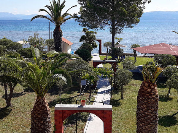 Seafront garden at Sand & Sea apartments in Agios Petros, Corfu