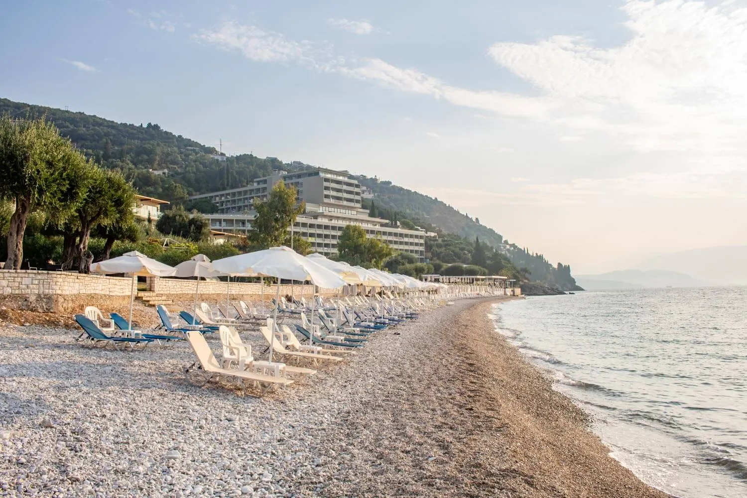 Seasonal sunbeds and parasols are available on the organised beach.