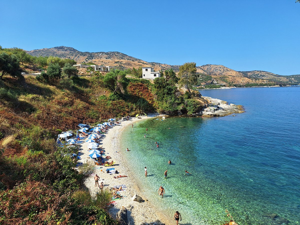 Seasonal sunbeds and parasols are available, but the small beach can fill quickly.