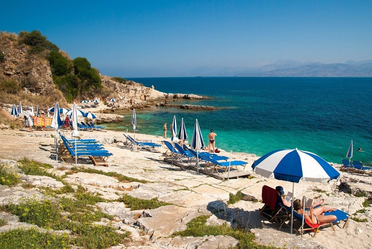 Seasonal sunbeds and parasols are available on the organised beach.