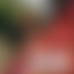 Firefighters actively battling flames as smoke rises from a residential house fire, demonstrating emergency response in action.