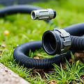 black drain hose for emptying black and grey tanksof campers.jpg