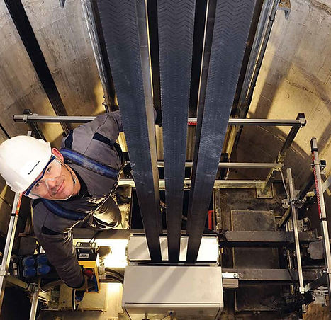Technician Worker Adjusting Elevator Mechanism