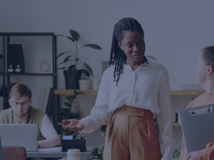 A conceptual image showing a glowing glass puzzle box on a boardroom table, symbolizing a thoughtful question, while a wall clock in the blurred background spins frantically.