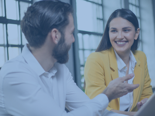 Cheerful business people discussing work together
