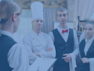 restaurant manager and his staff in kitchen. interacting to head chef in commercial kitchen.