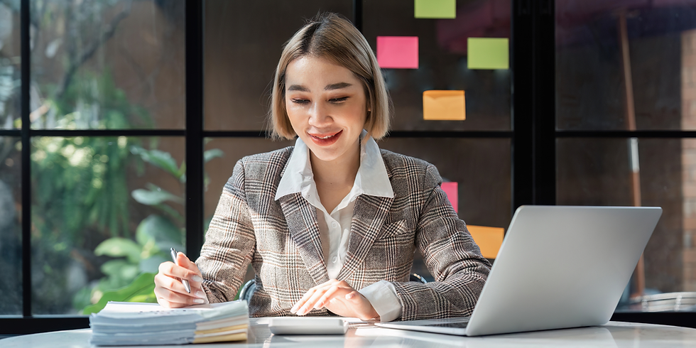 Young business woman checking paperwork from accounting department to analyse number on document, using computer laptop to check database