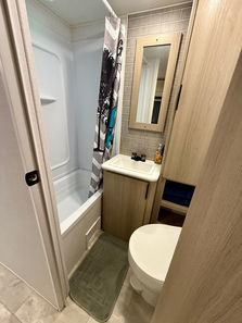 2025 Dutchmen Kodiak 280BHSL RV rental exterior – Bunkhouse camper rental set up at Lake Whitney campground.