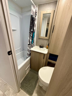 2025 Dutchmen Kodiak 280BHSL RV rental exterior – Bunkhouse camper rental set up at Lake Whitney campground.