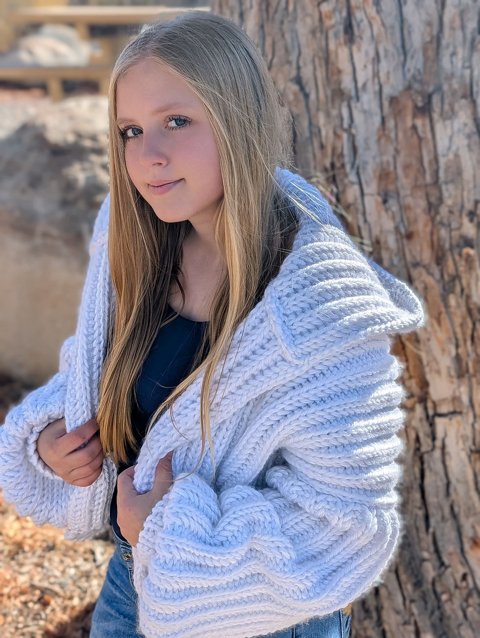 Thumbnail: Size view of white crochet cardigan showing texture of knit look stitches