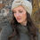 Thumbnail: Side view of women wearing beige crochet herringbone headband with tie