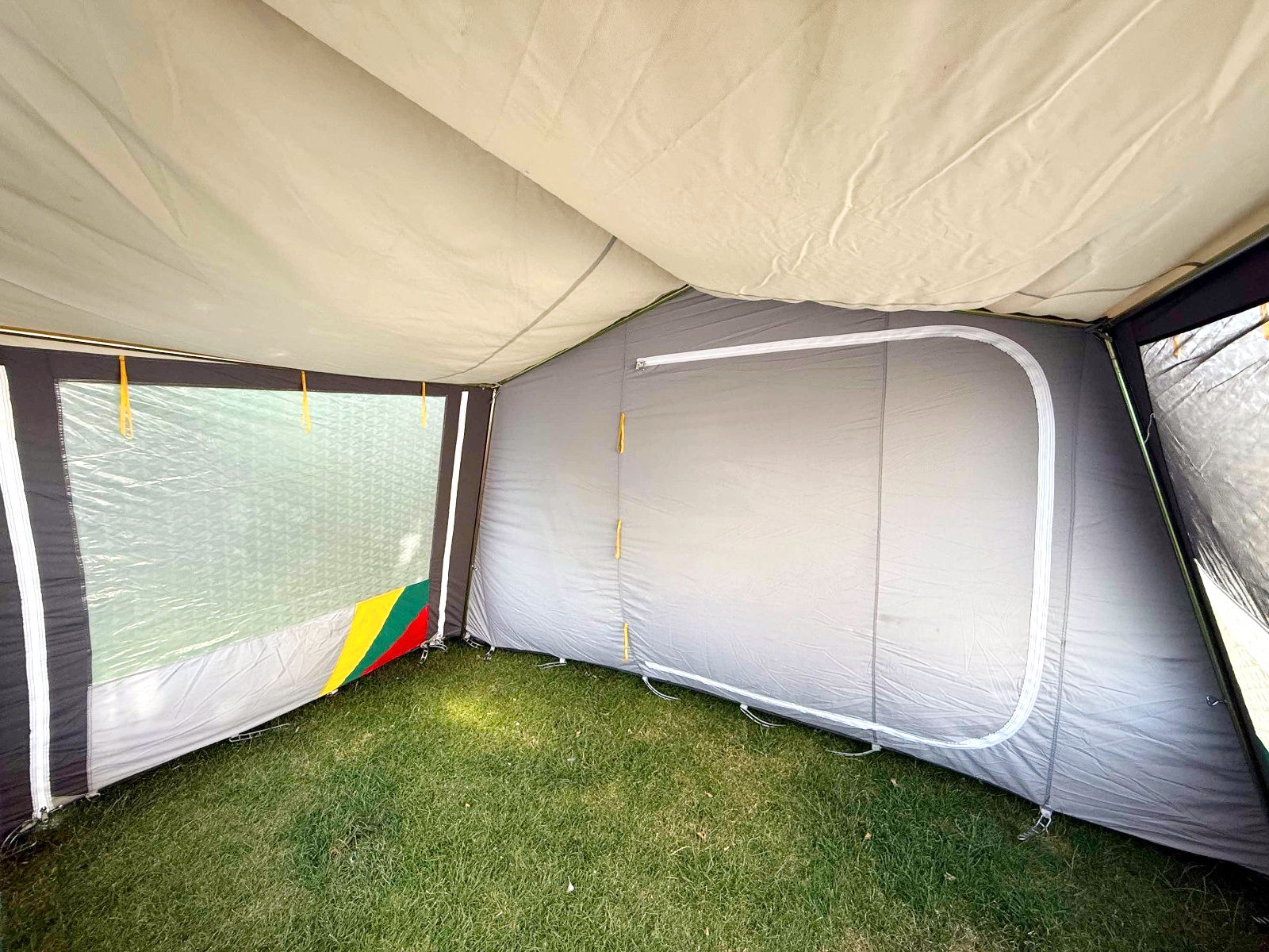 DWT Bregenz II 340cm grey campervan drive-away awning with steel pole frame, large windows and colourful detailing