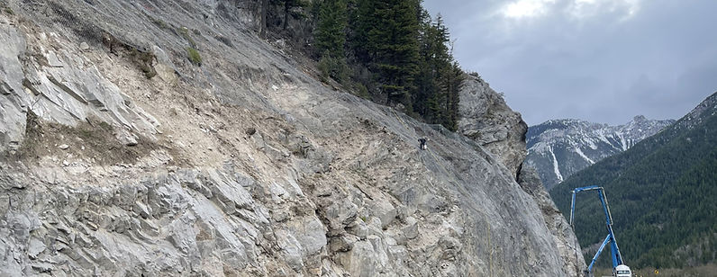 Dynamite Construction rock slope stabilization work on steep terrain, British Columbia