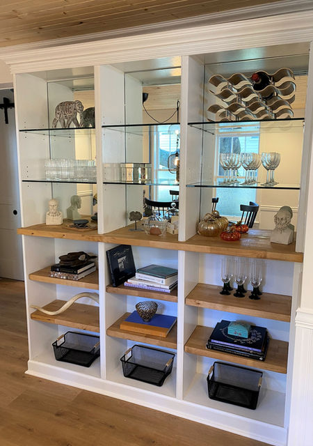 bookcase in dining room of twin oaks cottage pensacola, fl