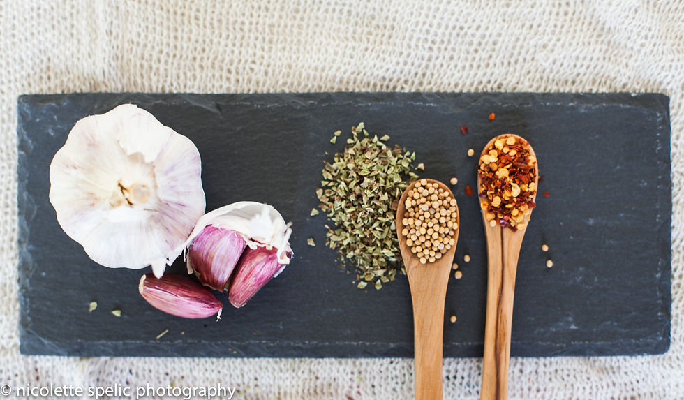 garlic_herbs_oregano_mustardseeds_chillies_wodden_spoons_slade.jpg