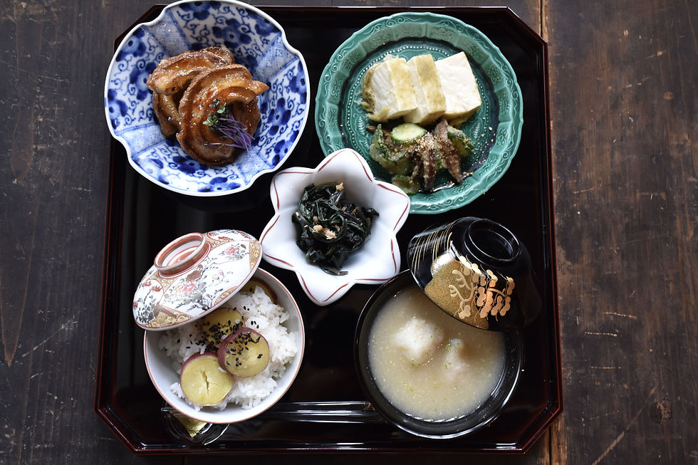 High angle view of a beautifully arranged Japanese meal on a traditional wooden table