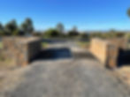 Stone entrances Armidale featuring a cattle grid drive.