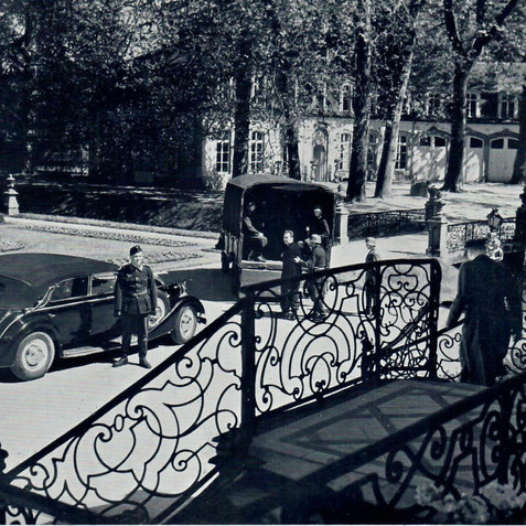 A scene filmed at Château de Sterrebeek with Marius Goring walking down the stairs. John Bailey (Philipe de Malvines) is standing at the back of the truck