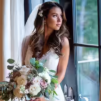 Elegant bride staring out window in South Jersey by Sean John Photography