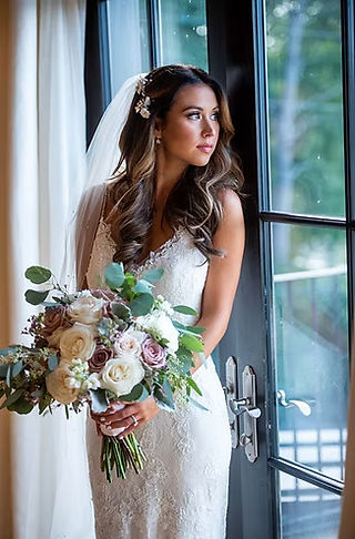 bride posing near window with refection