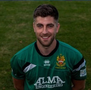 Professional headshot of Andy wearing the Hitchin Town FC Kit