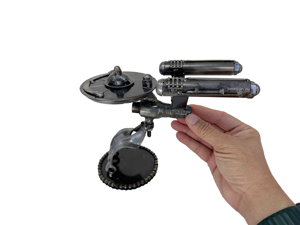 Thumbnail: Enterprise inspired recycled metal sculpture made from nuts, bolts, and scrap steel, displayed in a hand for scale.