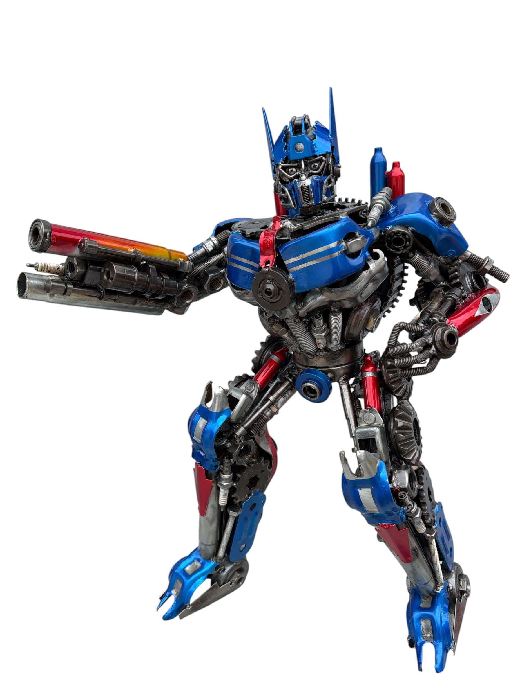 Iron Commander Optimus Prime-inspired recycled metal robot sculpture featuring blue and red armor, detailed mechanical face,