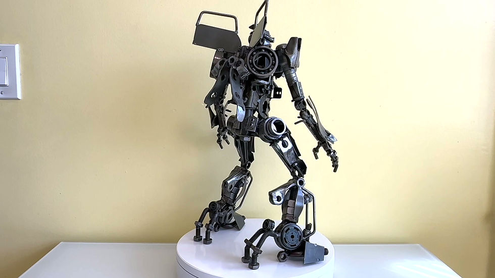 Thumbnail: “360° video of The Iron Defender, a Bumblebee-inspired recycled metal sculpture weighing 15 lb, showing detailed welding, arm