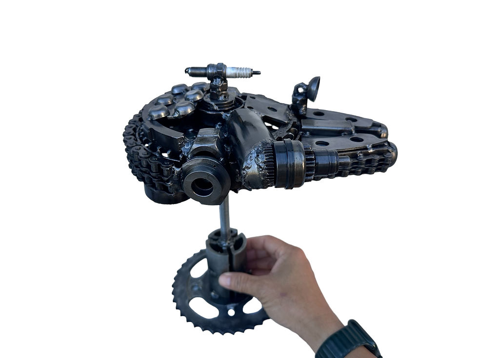 Thumbnail: Hand holding small Star Falcon sculpture for scale reference