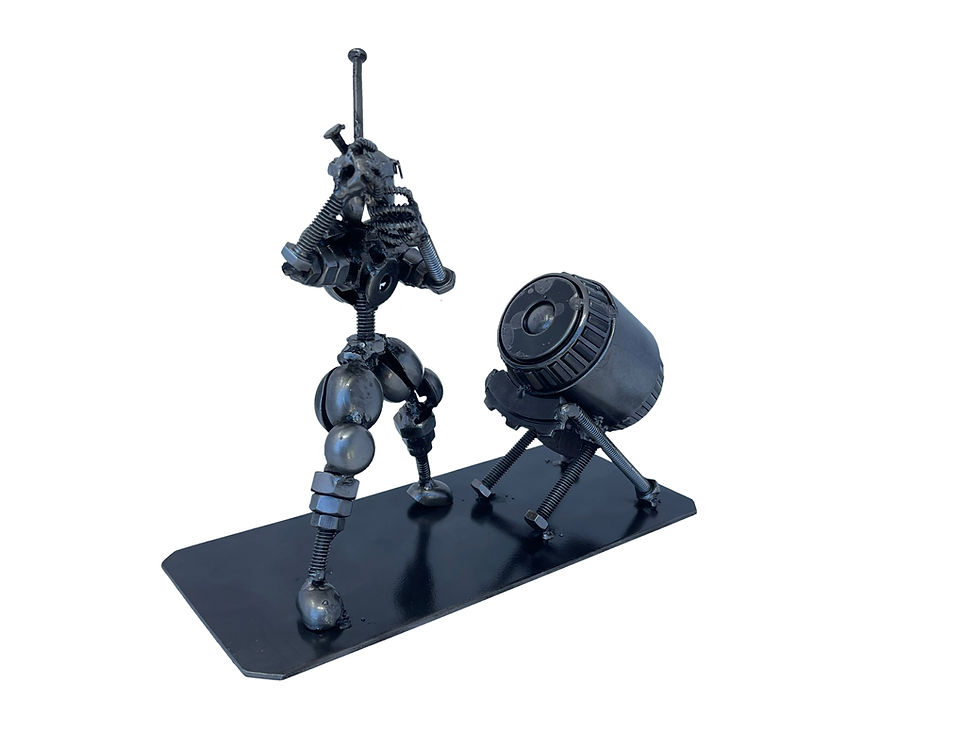 Handmade recycled metal taiko drummer sculpture in action pose with drum, industrial Japanese percussion metal art