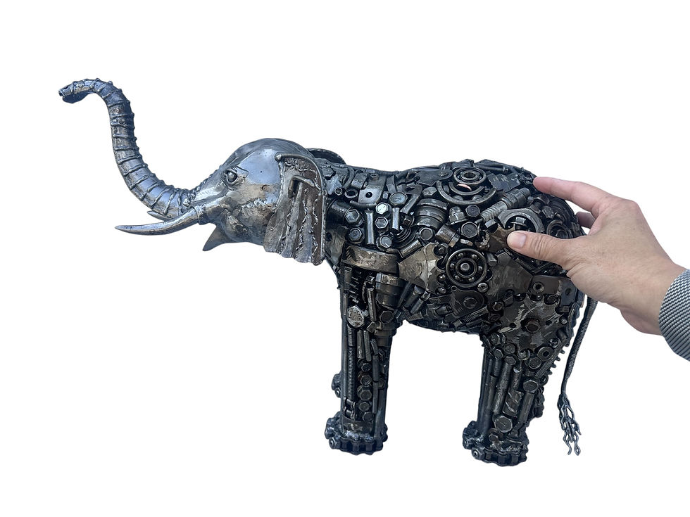Thumbnail: industrial elephant sculpture made from recycled machine parts and steel components