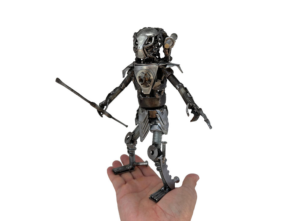 Thumbnail: Hand holding Mini Hunter recycled metal sculpture for scale, showing handcrafted details.