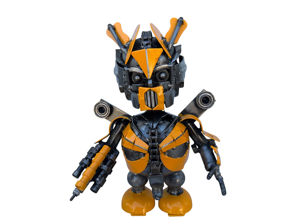 Front view of Buzz-Bolt funny yellow and black recycled metal robot sculpture with detailed mechanical armor and blaster arm.