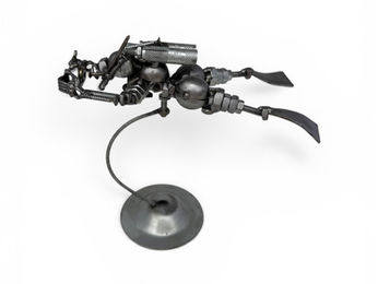 Handmade scrap metal sculpture of aScuba Diver, welded from recycled parts into a unique collectible sports figure.