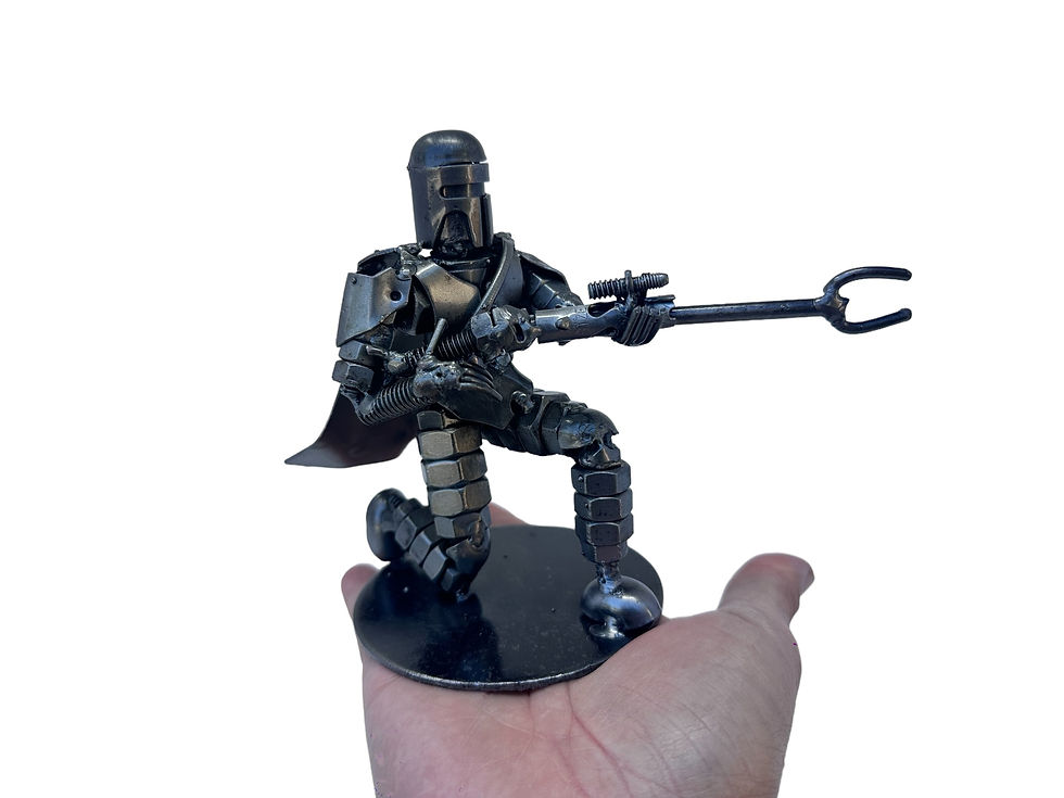 Thumbnail: Combat stance interstellar bounty hunter sculpture made from recycled steel parts