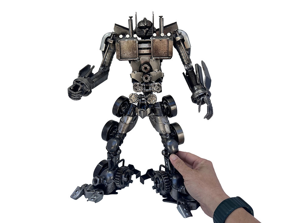 Thumbnail: Hand holding The Steel Sentinel recycled metal sculpture inspired by Optimus Prime