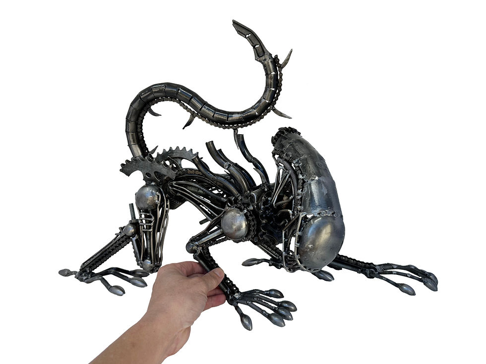 Thumbnail: Hand holding The Alien Stalker sculpture for scale reference.