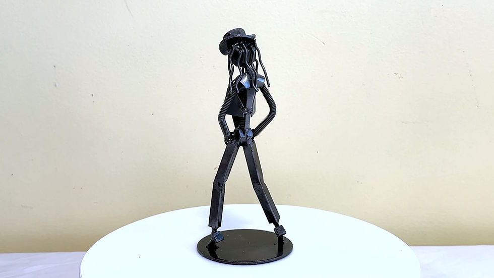 Thumbnail: Handmade Michael Jackson inspired recycled metal sculpture featuring a signature dance pose and fedora hat.