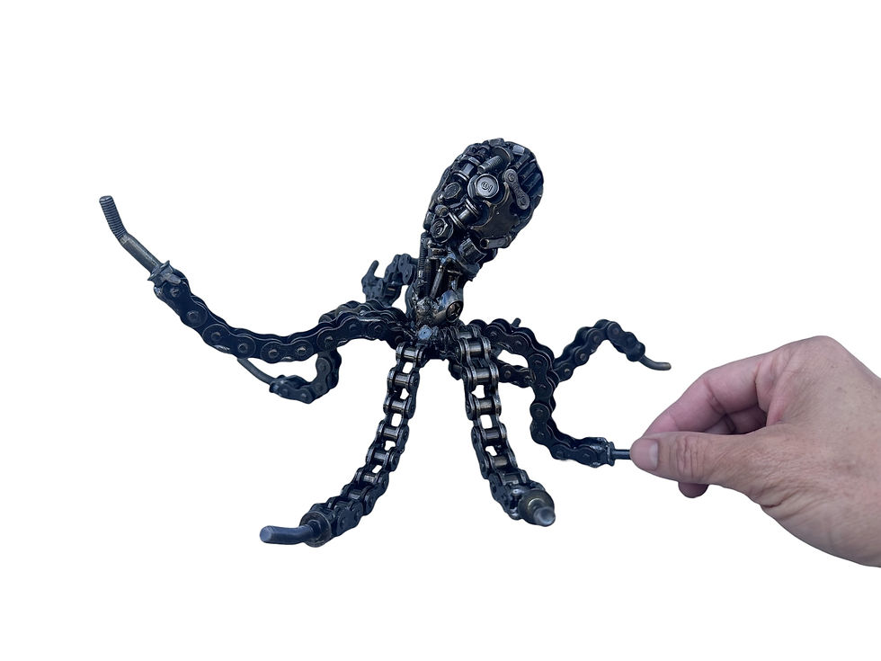 Thumbnail: close up recycled metal octopus sculpture showing mechanical head and chain arms