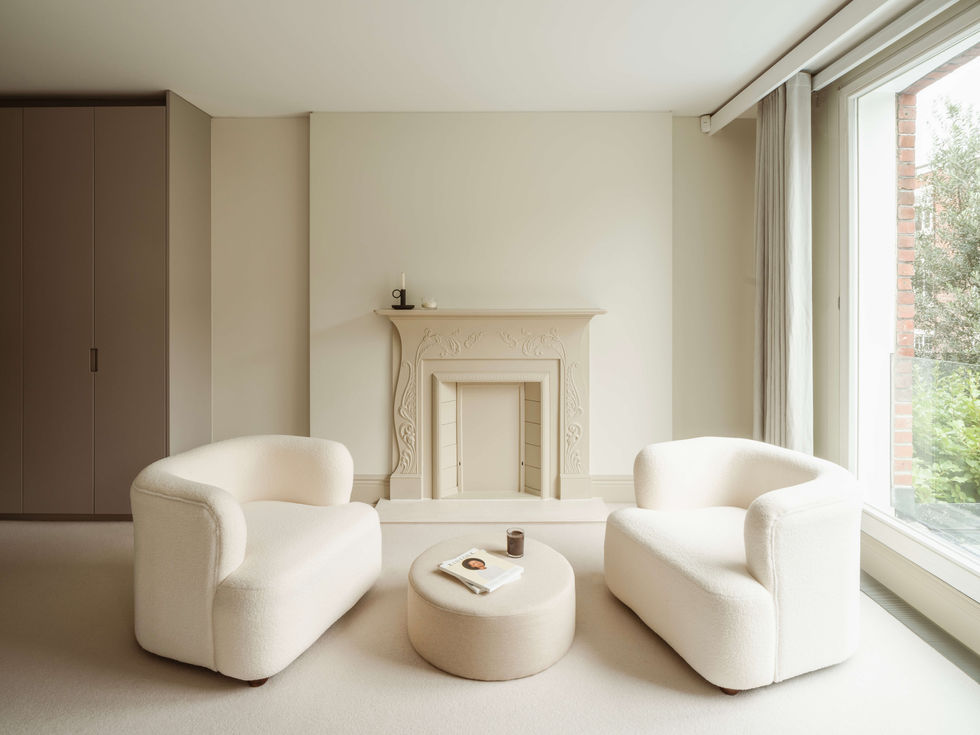 tak-studio-belsize-park-principal-bedroom-interior-design-boucle-armchairs-victorian-firep