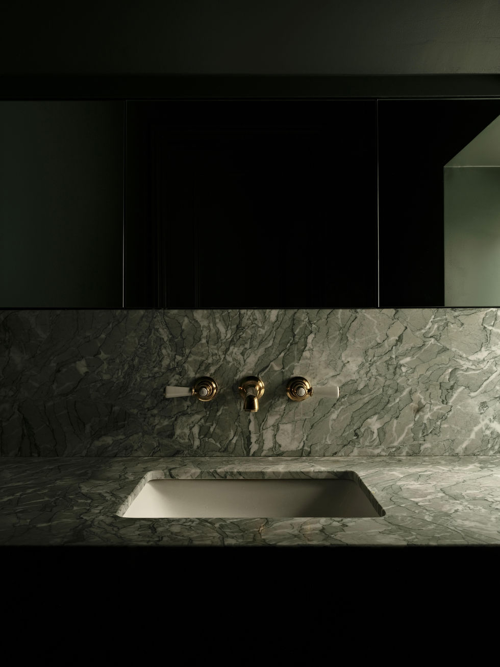 tak-studio-chelsea-cloakroom-verde-marble-sink-surround-brass-lever-taps.jpg
