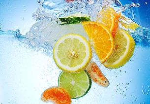 tropical fruits fall deeply under water with a big splash.jpg