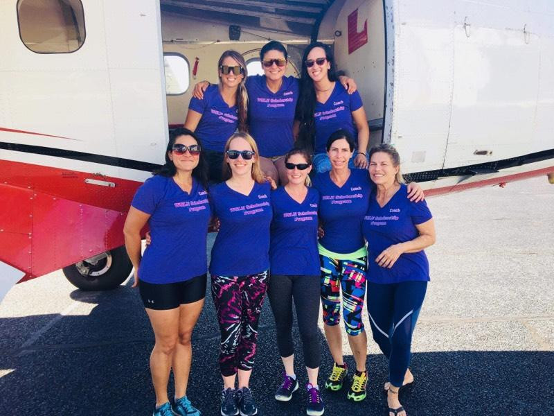 Women skydivers pose for picture WSLN